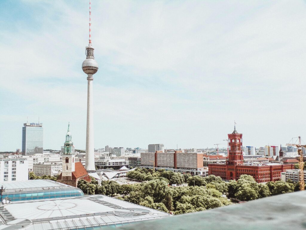pexels-photo-1128408-1128408 A breathtaking daytime aerial shot of Berlin featuring the Fernsehturm and vibrant architecture.